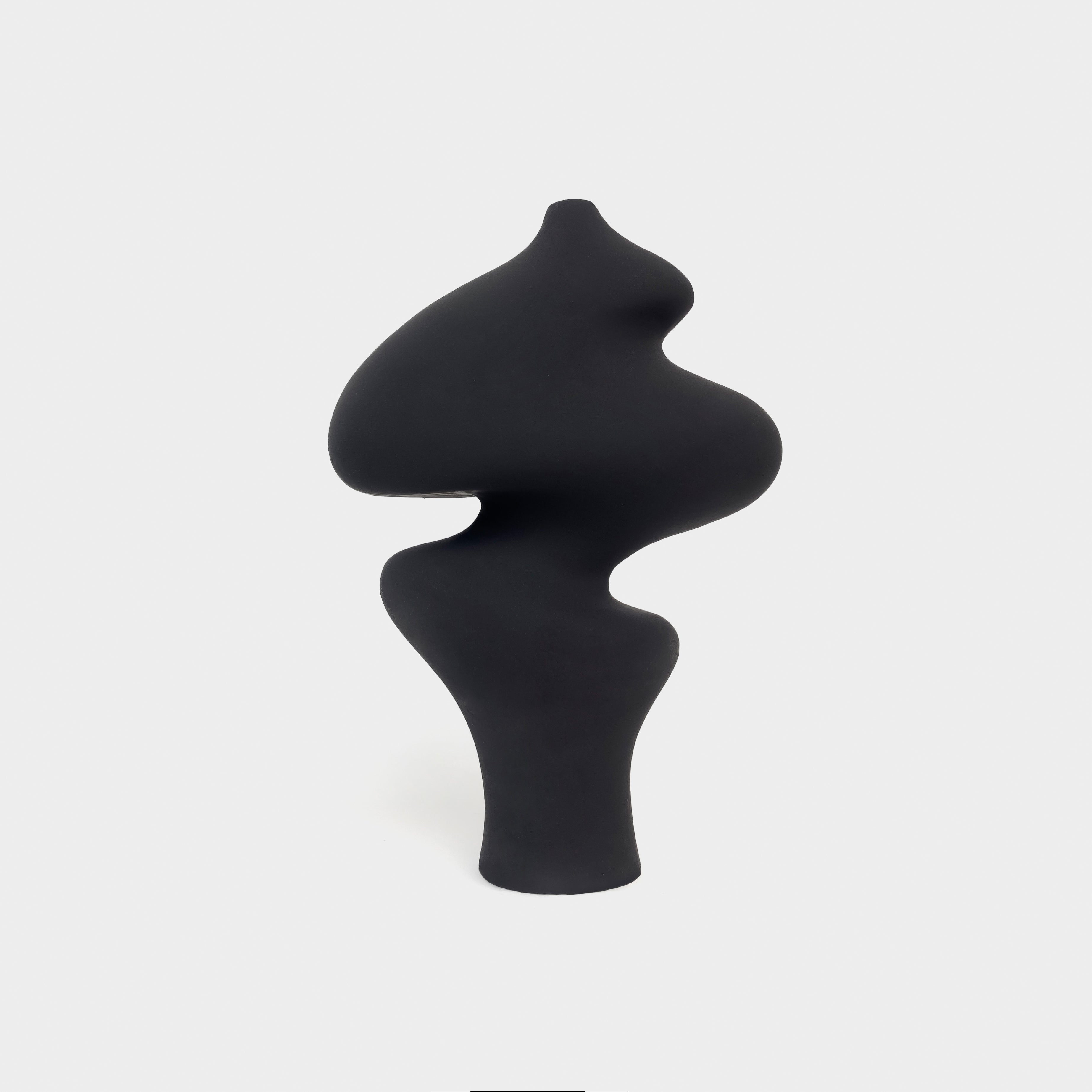 Simon A minimalist tabletop sculpture in charcoal matte finish, styled on a console table